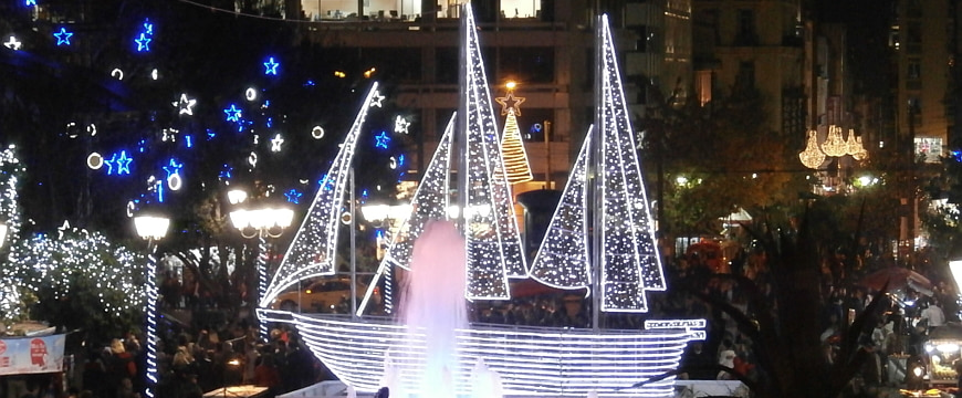 Sailboat Christmas decoration lit up with white lights in Syntagma Square in Athens