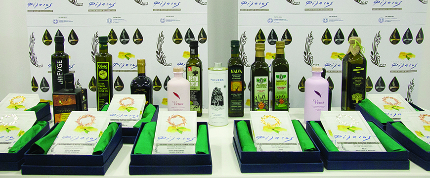 Kotinos 2017 competition awards and bottles of prize winning olive oil