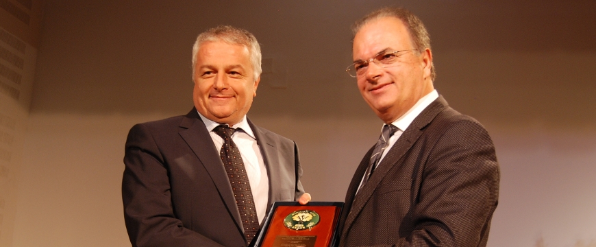 Ermis Hotel representative accepting an award from the Mayor of Rethymno