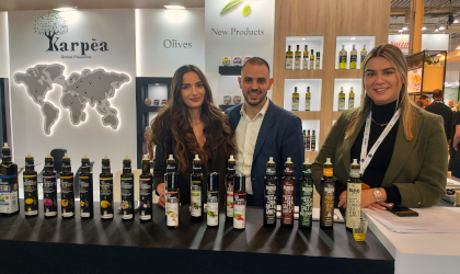 the Karpea stand at the Food Expo, with three people behind many bottles with unusual pourers