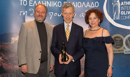 Maria Katsouli with Dino.Stergides (left) and an award winner at the Athena olive oil competition awards ceremony