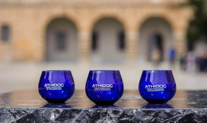ATHIOOC blue tasting glasses in front of arches