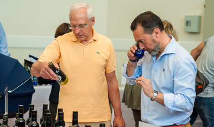 Dominique Perrot and Gabriel Malet considering different olive oils at the tasting day