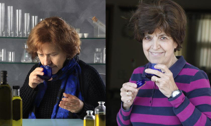 Efi Christopoulou and Maria Lazaraki holding blue olive oil tasting glasses