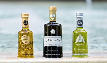 3 different Elawon olive oil bottles in a row