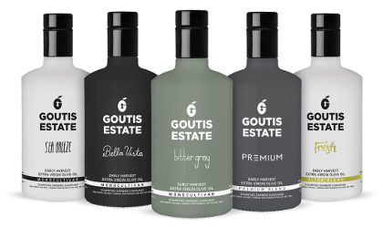 Five bottles of different Goutis Estate olive oils in a row