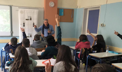 Ioannis Kampouris teaching students in a Greek classroom