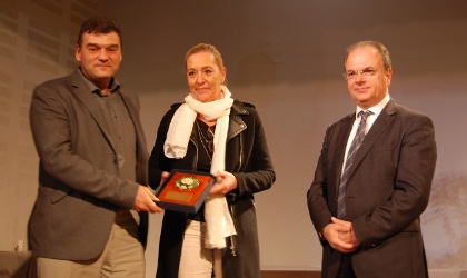 Grecotel representatives accepting an award from the Mayor of Rethymno