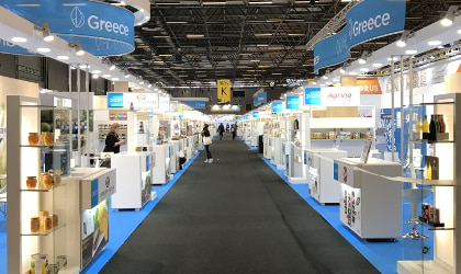 A view of the Greece section of SIAL Paris, looking down the aisle, with booths on either side