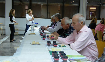 Participants sitting at a long table for a guided tasting session