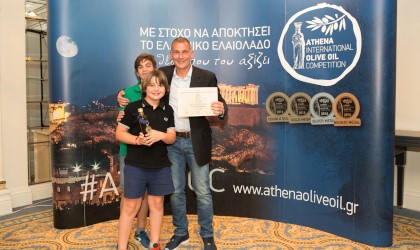 Giovanni Bianchi and his two sons with their award at the Athena International Olive Oil Competition