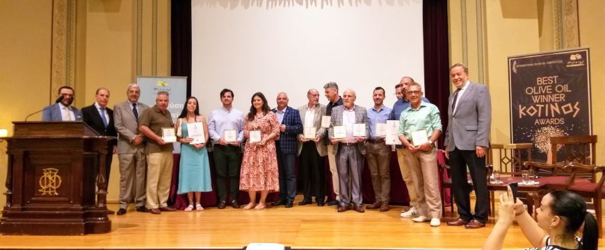 Kotinos Awards winners and Filaios Society board members on stage at the Parnassos Literary Society in Athens