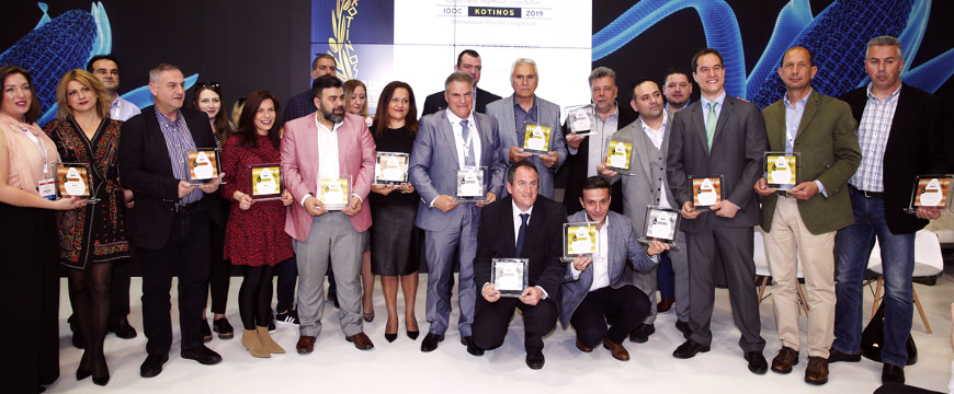 the winners of the Kotinos competition standing next to each other, holding their awards