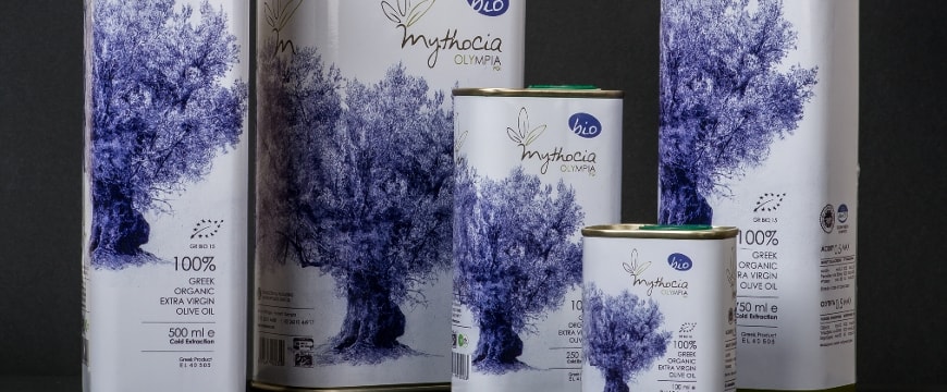 Mythocia Olympia organic olive oil tins of various sizes, with olive tree drawings on them