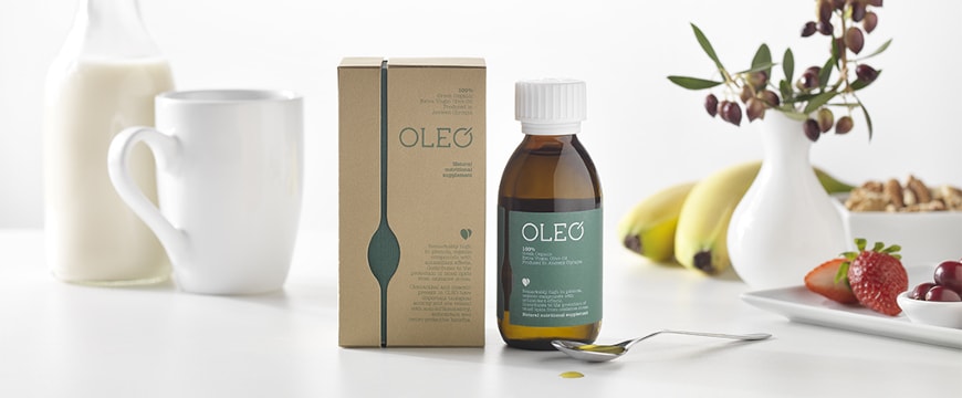 OLEO medicine bottle and box with milk, fruit, olives like a breakfast setup