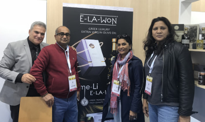 Ioannis Kampouris and visitors at the E-la-won booth at SIAL Paris