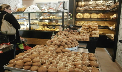 Melomakarona cookies and other baked goods in a Greek bakery
