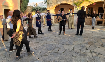 costumed professional dancers and conference participants dancing together at AgrecoFarms