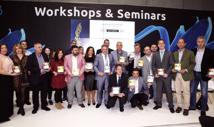 the winners of the Kotinos competition standing next to each other, holding their awards