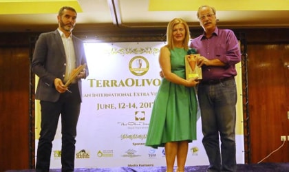 Emmanouil Chnaris, Eleftheria Germanaki, and Moshe Spak on the podium at the Terra Olivo Awards ceremony